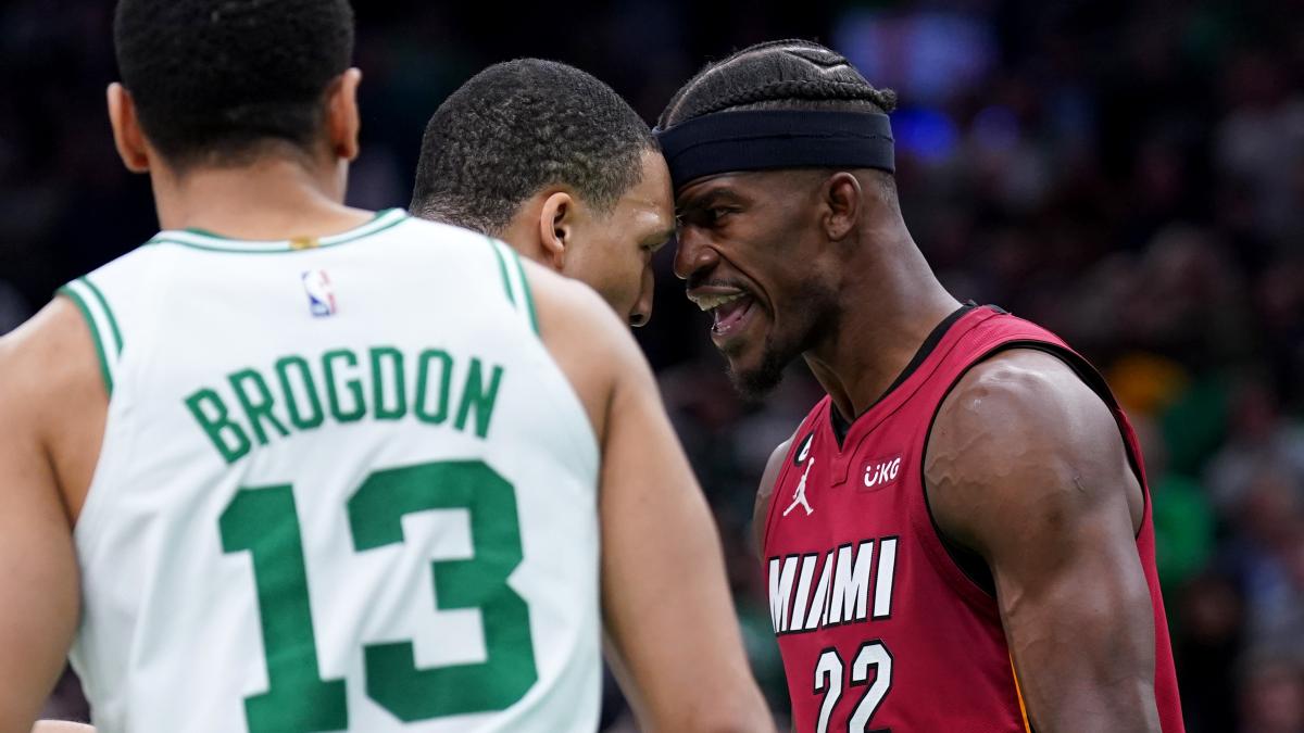 May 19, 2023; Boston, Massachusetts, USA; Boston Celtics forward Grant Williams (12) and Miami Heat forward Jimmy Butler (22) react after a play during the second half of game two of the Eastern Conference Finals for the 2023 NBA playoffs at TD Garden.