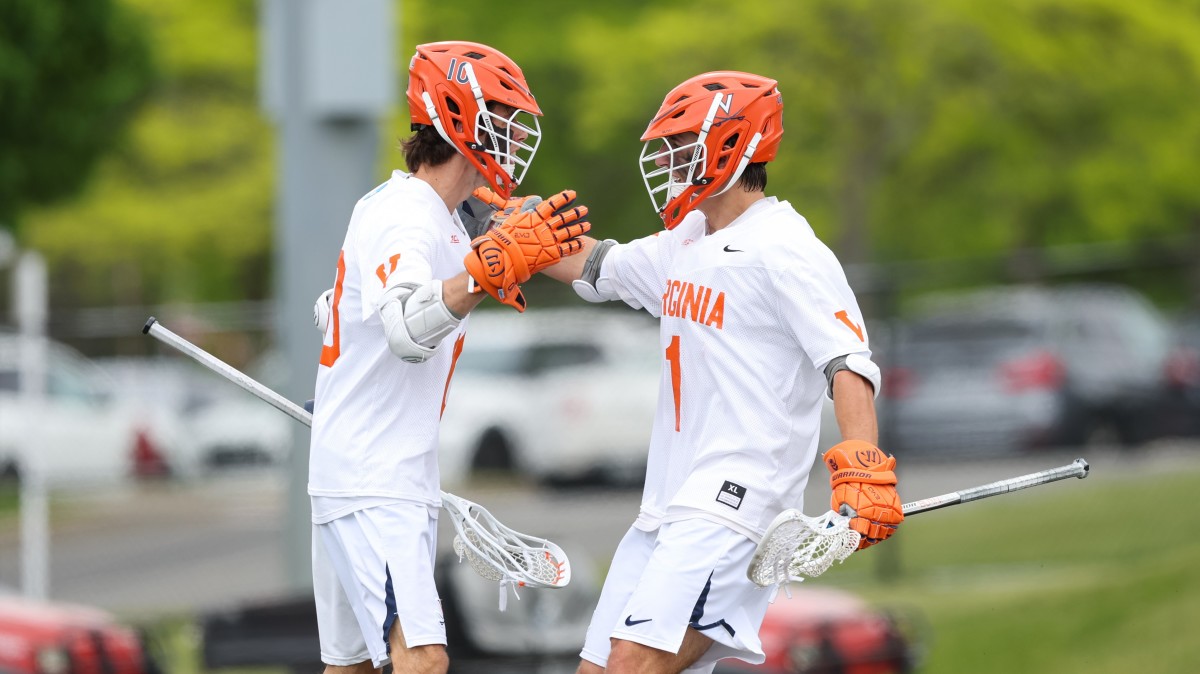 Xander Dickson and Connor Shellenberger celebrate after scoring a goal during the Virginia men's lacrosse game against Georgetown in the quarterfinals of the NCAA Men's Lacrosse Championship at Casey Stadium in Albany, New York.