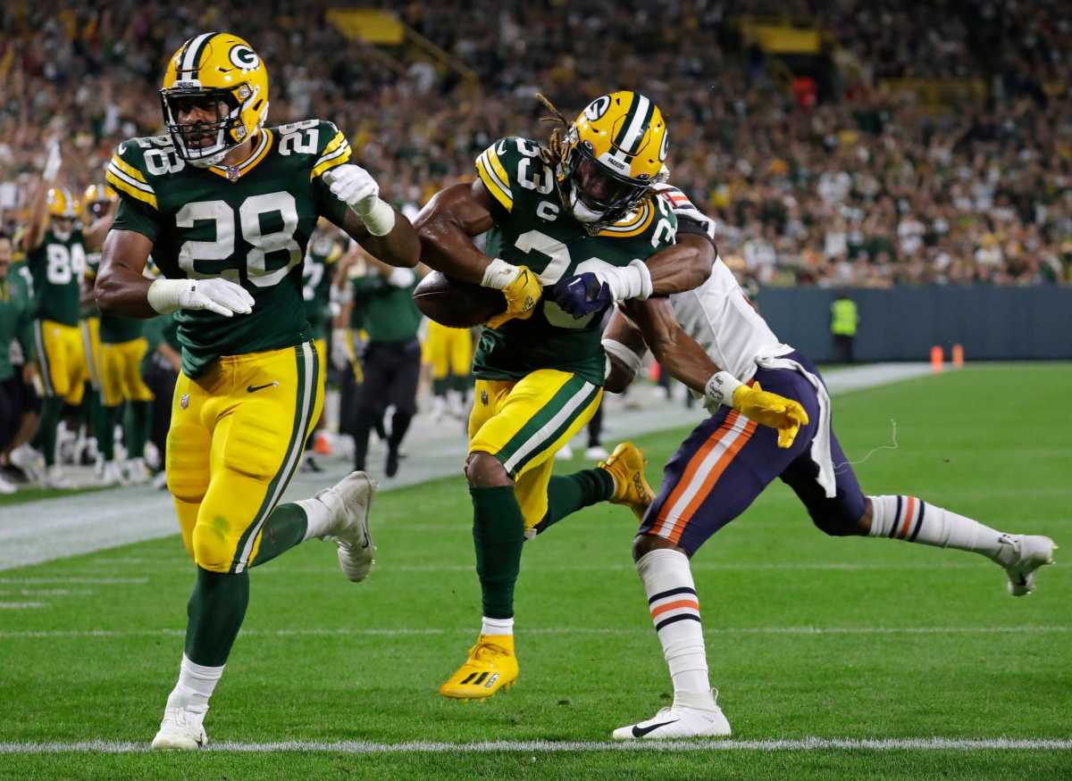 AJ Dillon leads Aaron Jones into the end zone. (Photo by USA Today Sports Images)