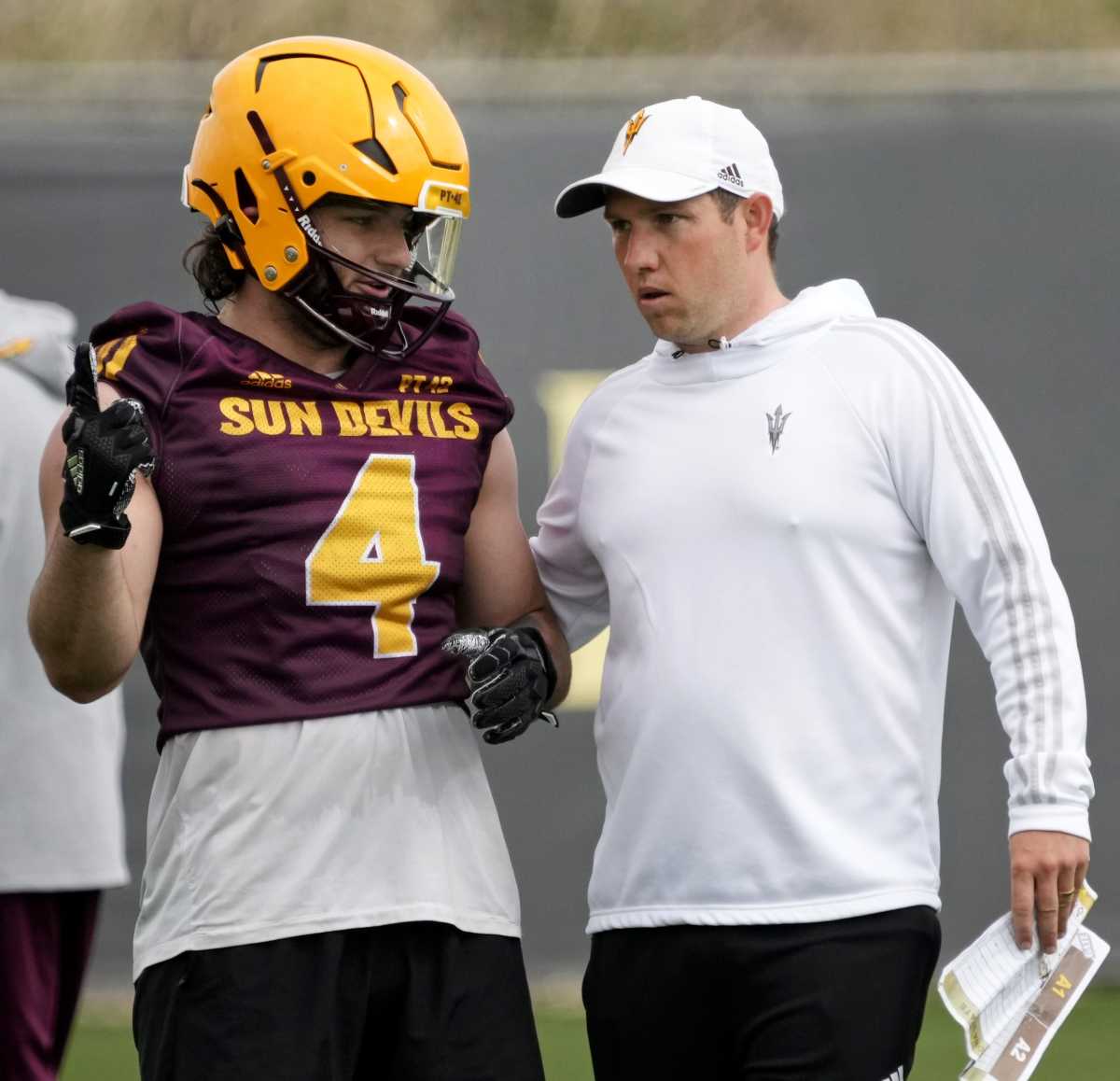 Arizona State Sun Devils running back Cameron Skattebo talks with head coach Kenny Dillingham during spring football practice at the Kajikawa practice fields in Tempe on March 16, 2023. Ncaa Football Asu Spring Football Practice
