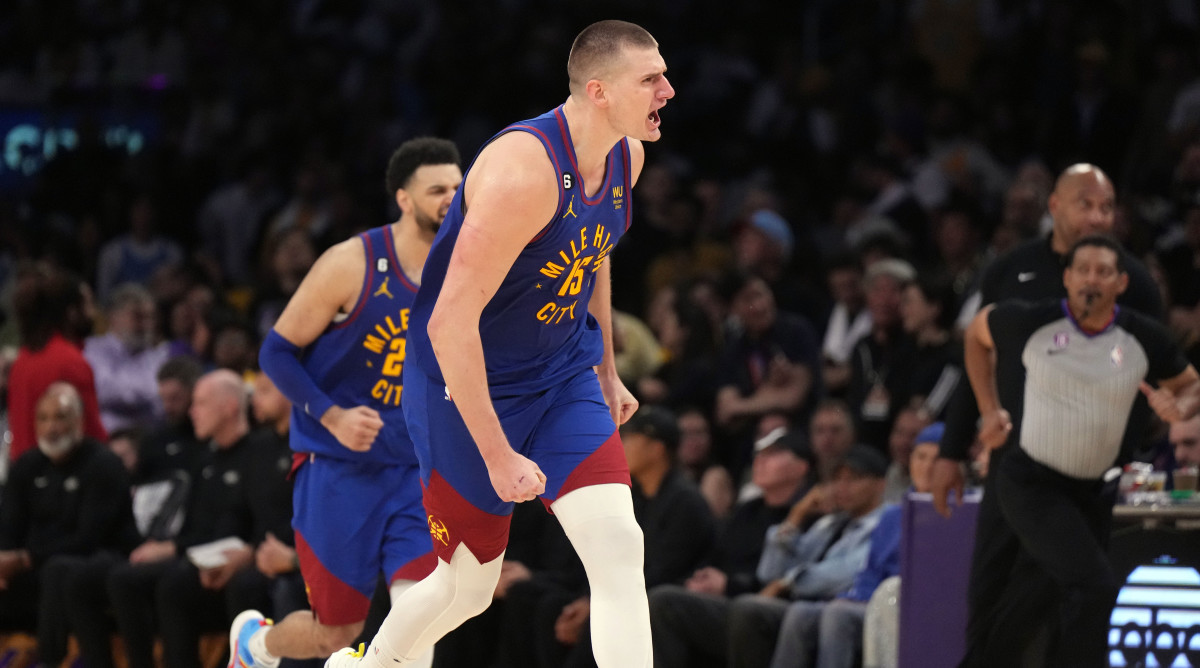 Nikola Jokic celebrates against the Lakers