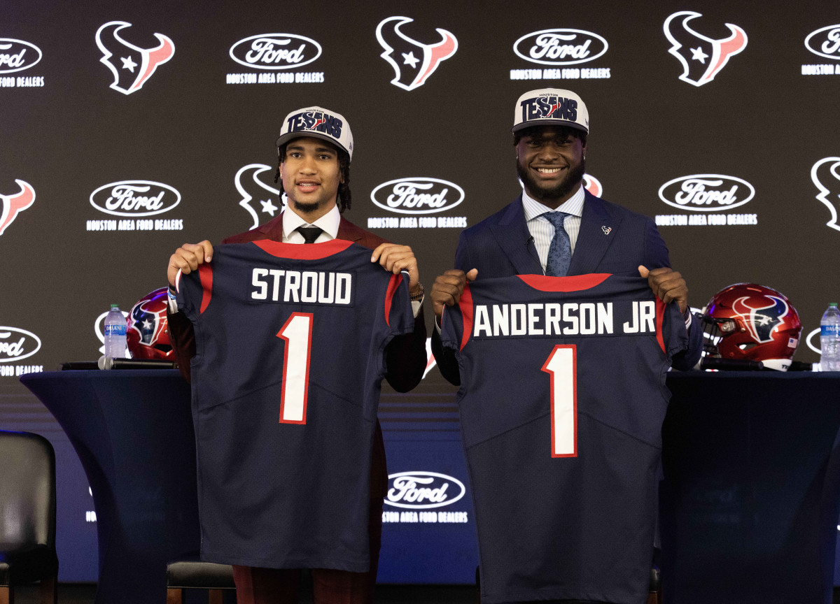 From left to right, Houston Texans quarterback CJ Stroud (left), second overall pick in the 2023 NFL Draft, and Texans linebacker Will Anderson Jr., third overall pick in the 2023 NFL Draft, pose for a photo holding Texans jerseys with their last names on them