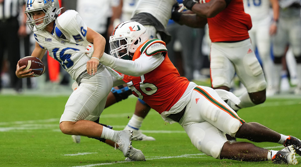 Miami DT Leonard Taylor III drags down Middle Tennessee QB Chase Cunningham.