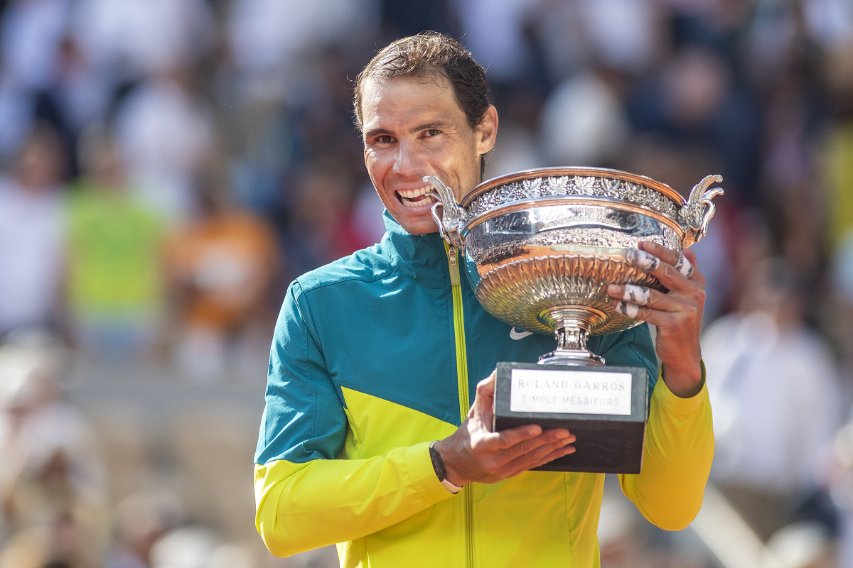 Rafael Nadal poses with his 14th French Open title trophy.