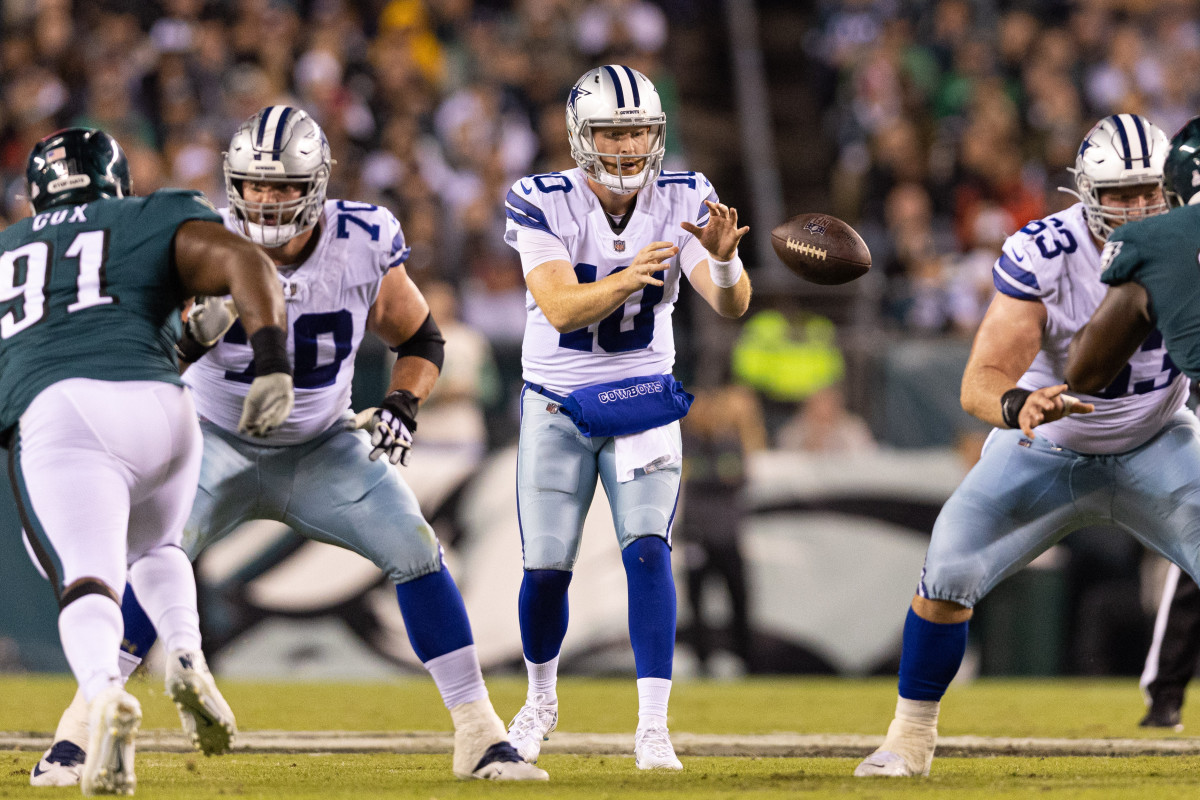 Cowboys quarterback Cooper Rush puts his hands up to catch the ball which was hiked to him at center