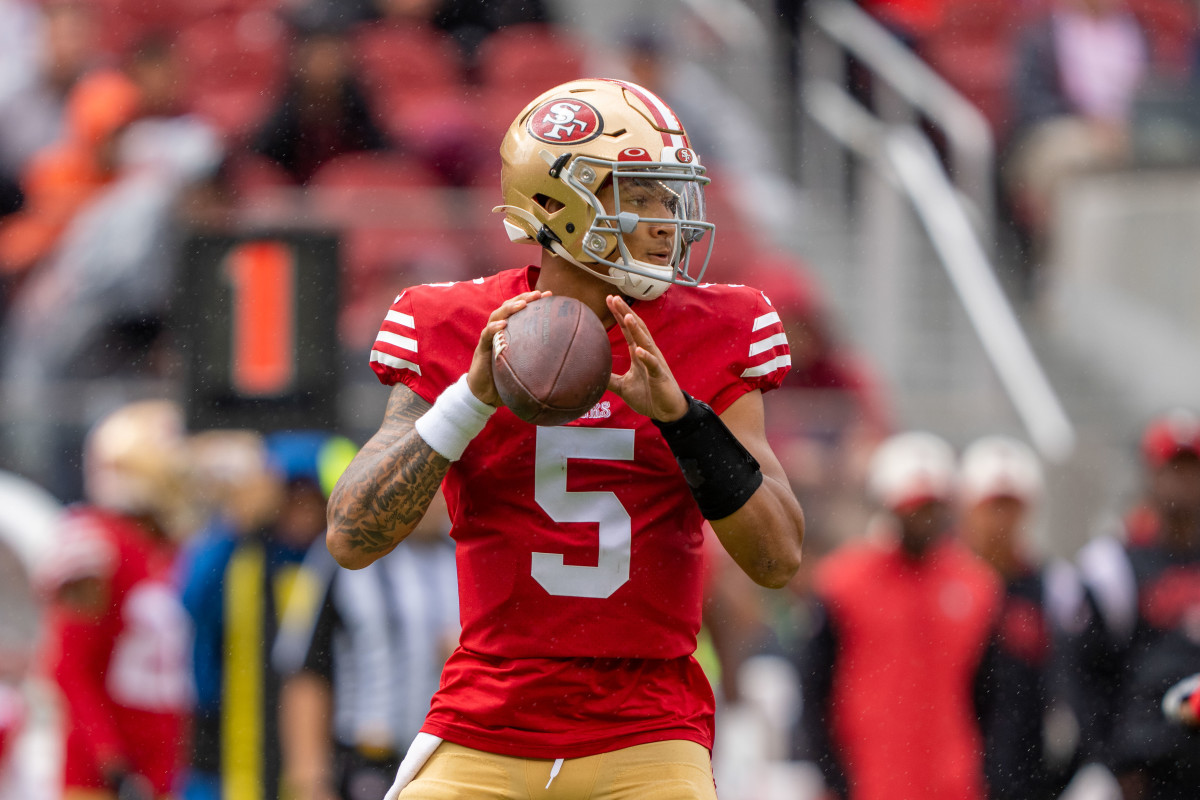 San Francisco 49ers quarterback Trey Lance holds the ball in both hands