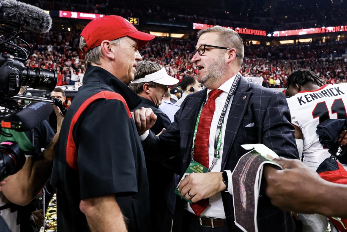 Josh Brooks congratulates Todd Monken after the 2022 National Championship game