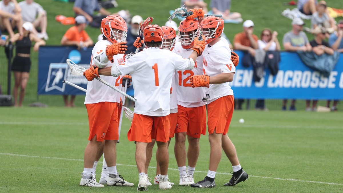 Connor Shellenberger celebrates with his team after a goal during the Virginia men's lacrosse game against Richmond in the first round of the NCAA Men's Lacrosse Championship at Klockner Stadium.