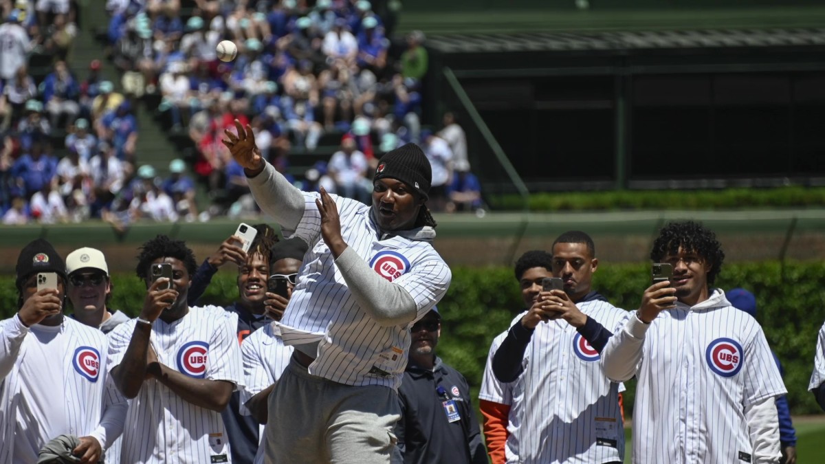 Gervon Dexter, still unsigned, threw out the first pitch Friday at the Cubs-Reds game at Wrigley Field as all the rookies attended.