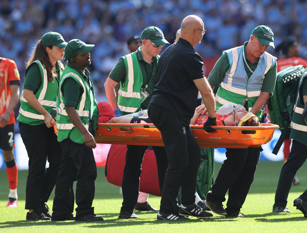 Luton Town captain Tom Lockyer pictured leaving the 2023 EFL Championship play-off final on a stretcher after collapsing on the field minutes earlier