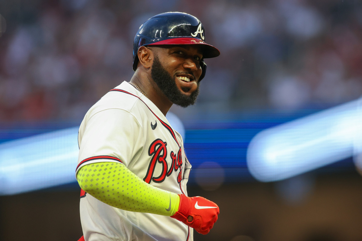 May 25, 2023; Atlanta, Georgia, USA; Atlanta Braves designated hitter Marcell Ozuna (20) reacts on third base against the Philadelphia Phillies in the fourth inning at Truist Park.