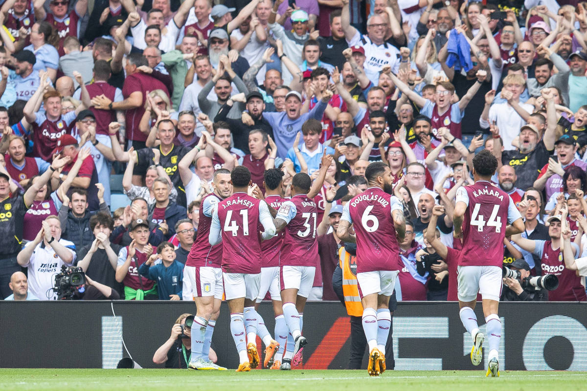 Aston Villa players pictured celebrating after scoring a goal against Brighton in May 2023