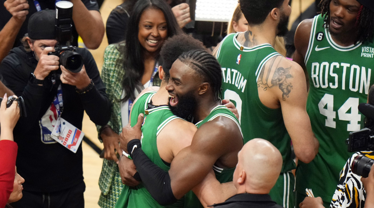 Derrick White and Jaylen Brown embracing.