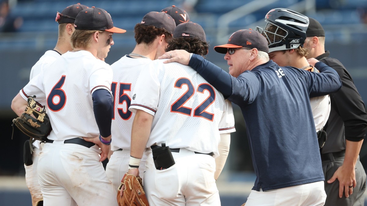 Brian O'Connor huddles with his team on the pitcher's mound during the Virginia baseball game against Florida State at Disharoon Park.