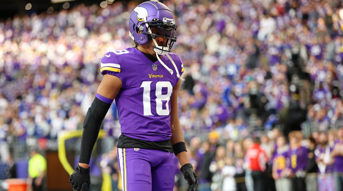 Minnesota Vikings wide receiver Justin Jefferson stands on the field