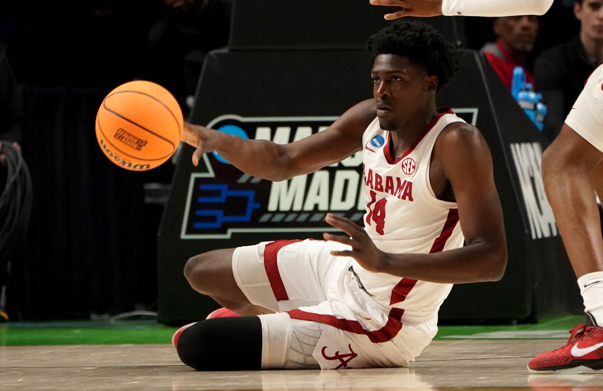 Mar 18, 2023; Birmingham, AL, USA; Alabama Crimson Tide center Charles Bediako (14) passes during the first half against the Maryland Terrapins at Legacy Arena.