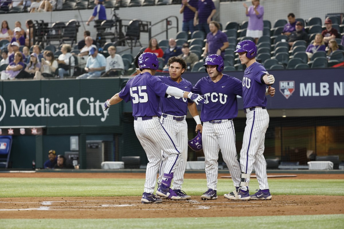 Brayden Taylor celebrates with TCU baseball teammates after a homerun during the 2023 Phillips 66 Big 12 Championship