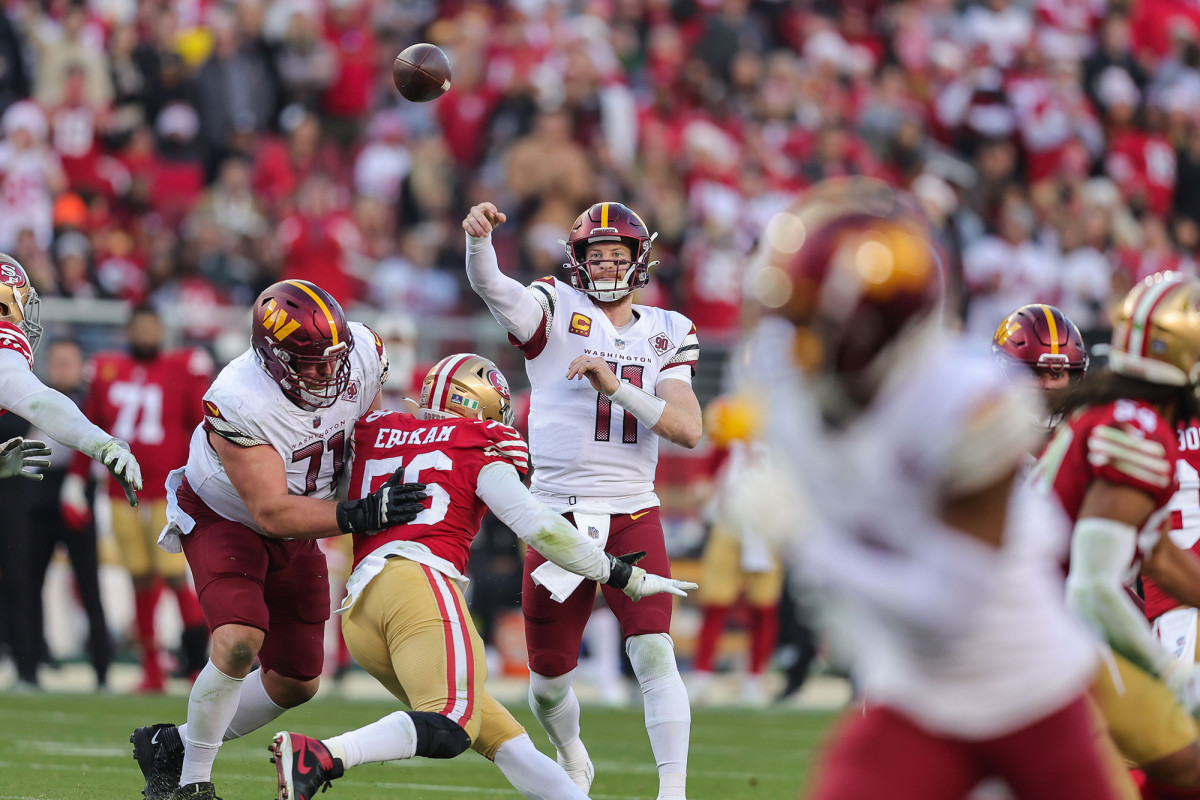 Carson Wentz throwing a pass for the Commanders