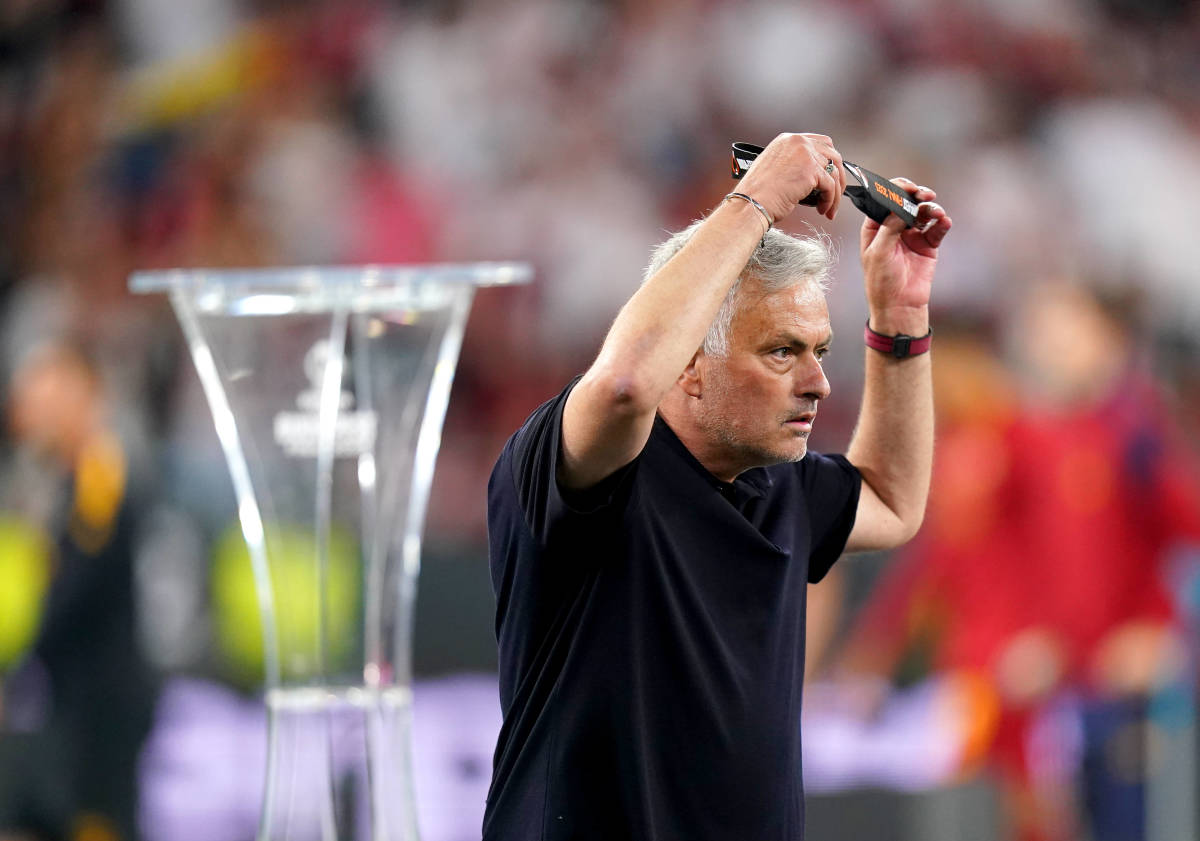 Roma manager Jose Mourinho pictured removing his silver medal after his team lost to Sevilla in the 2023 UEFA Europa League final