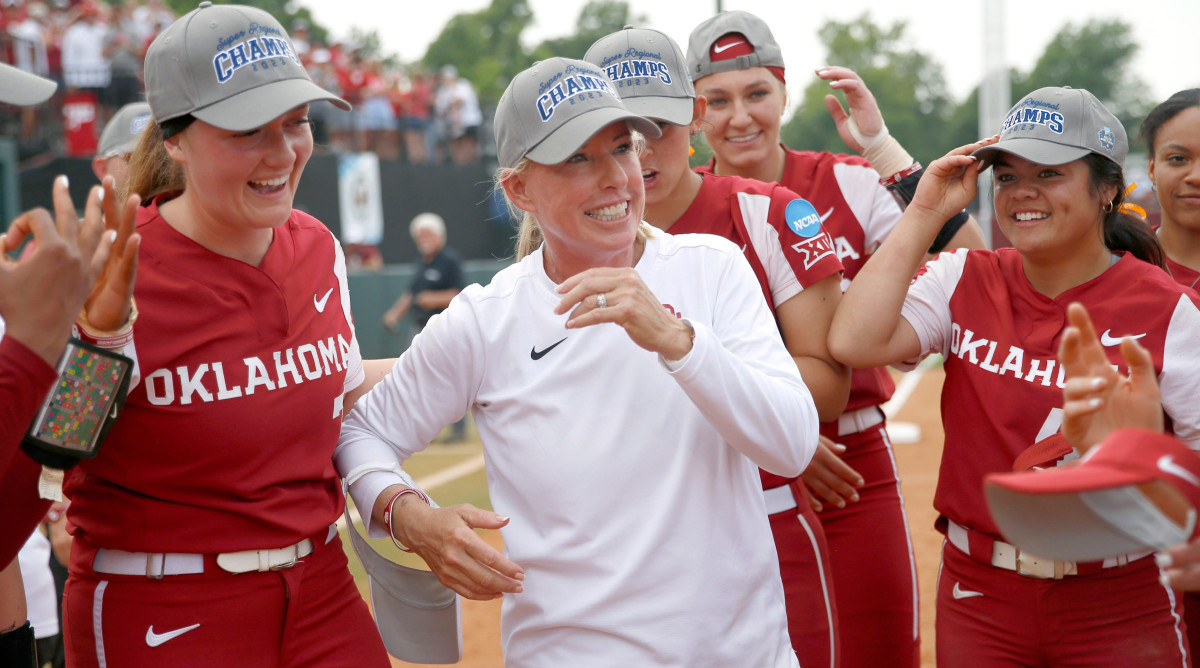 Oklahoma head coach Patty Gasso celebrates with players after beating Clemson in the super regionals.