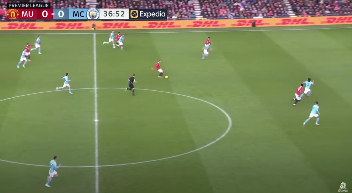 Manchester United’s Christian Eriksen plays a ball into Marcus Rashford.