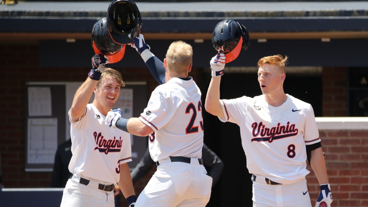 Ethan Anderson celebrates with Kyle Teel and Casey Saucke at home plate after hitting a home run during the Virginia baseball game against Army in the Charlottesville Regional of the NCAA Baseball Tournament at Disharoon Park.