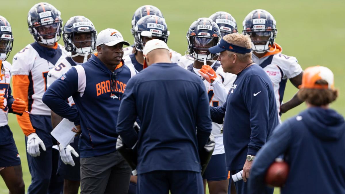 Denver Broncos defensive coordinator Vance Joseph talks with head coach Sean Payton