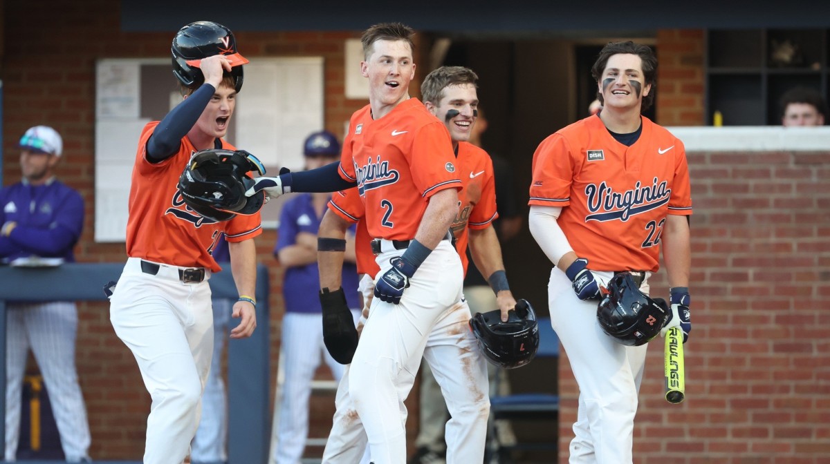 Ethan O'Donnell celebrates with Colin Tuft, Henry Godbout, and Jake Gelof at home plate after hitting a three-run home run during the Virginia baseball game against East Carolina in the Charlottesville Regional of the NCAA Baseball Tournament at Disharoon Park.