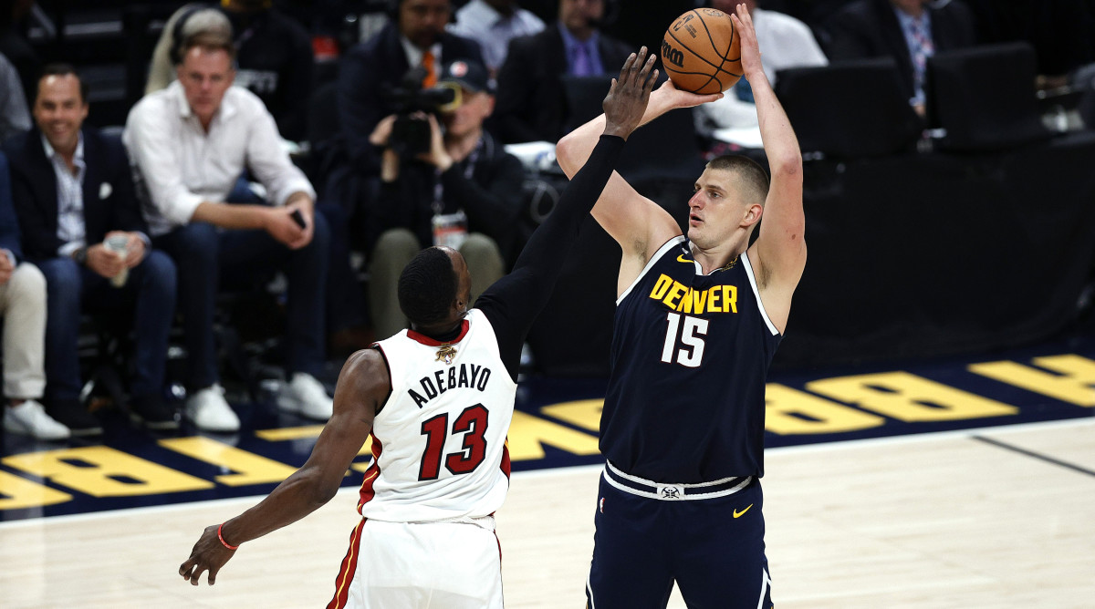 Nuggets center Nikola Jokic shoots against Miami center Bam Adebayo in game two of the 2023 NBA Finals.