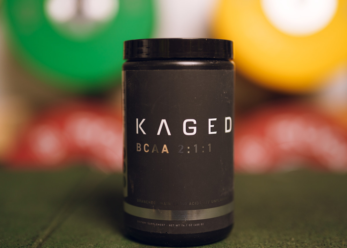 A black and gold container of Kaged BCAA 2:1:1 supplement