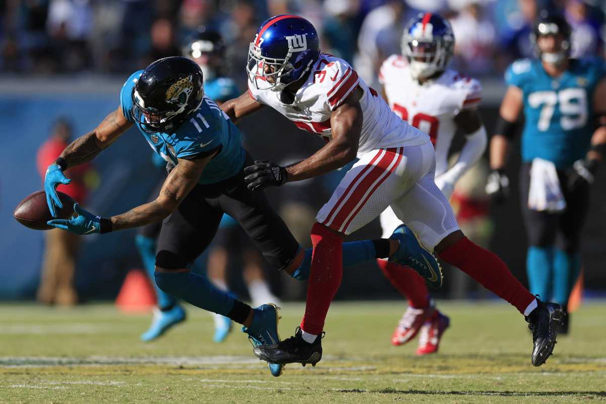 Jacksonville Jaguars wide receiver Marvin Jones Jr. (11) can't haul in a reception against New York Giants cornerback Fabian Moreau (37) during the fourth quarter on the final drive of a regular season NFL football matchup Sunday, Oct. 23, 2022 at TIAA Bank Field in Jacksonville. The New York Giants defeated the Jacksonville Jaguars 23-17.