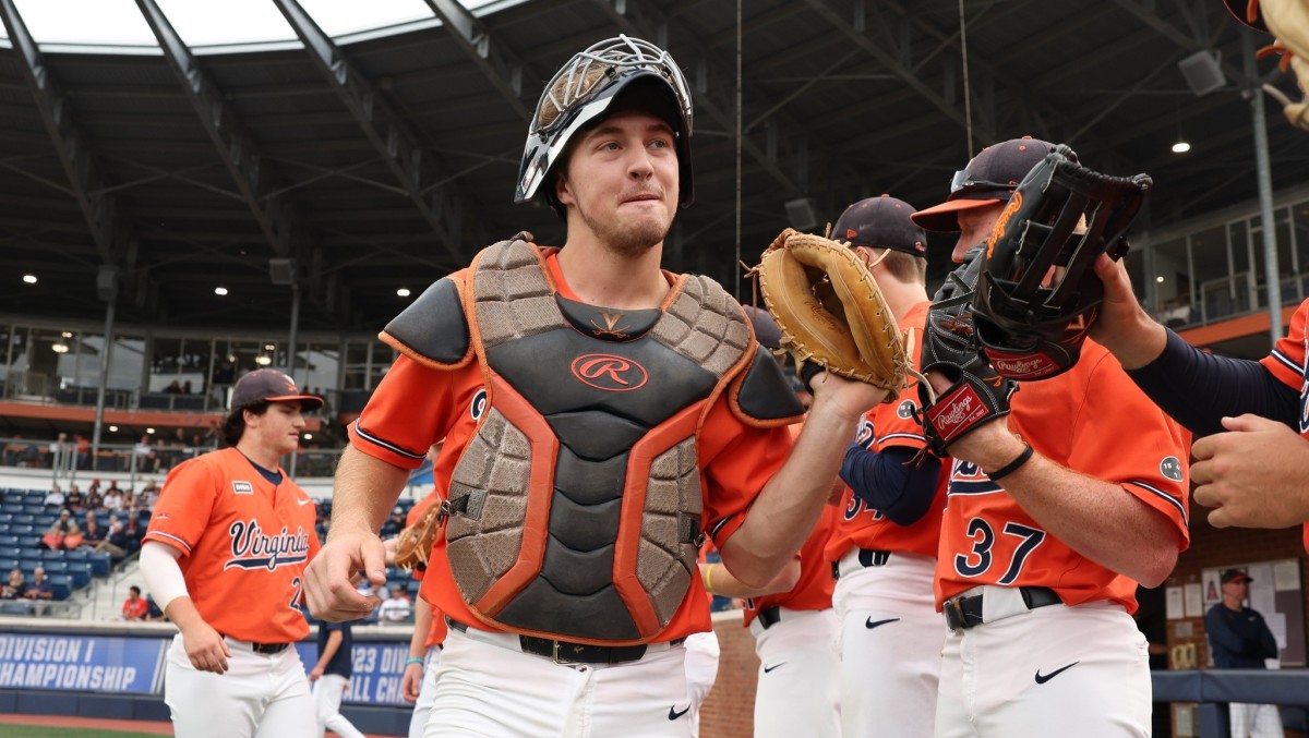 Kyle Teel high fives his teammates before the Virginia baseball game against East Carolina in the Charlottesville Regional of the NCAA Baseball Tournament at Disharoon Park.