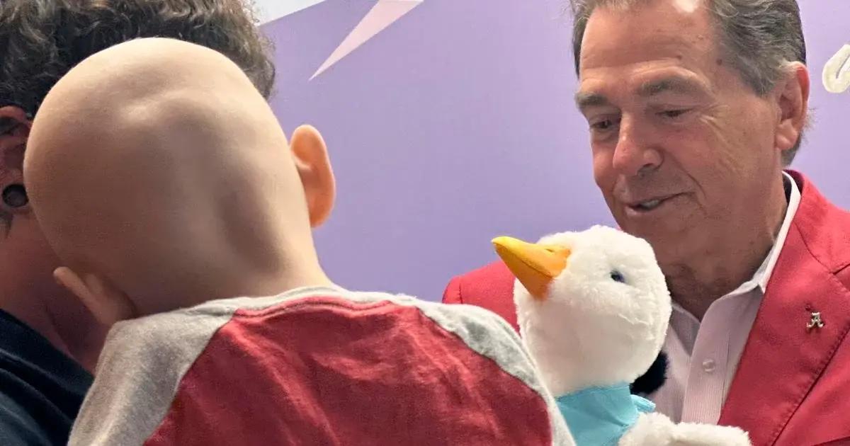 Nick Saban visits cancer patients at Children's Hospital.