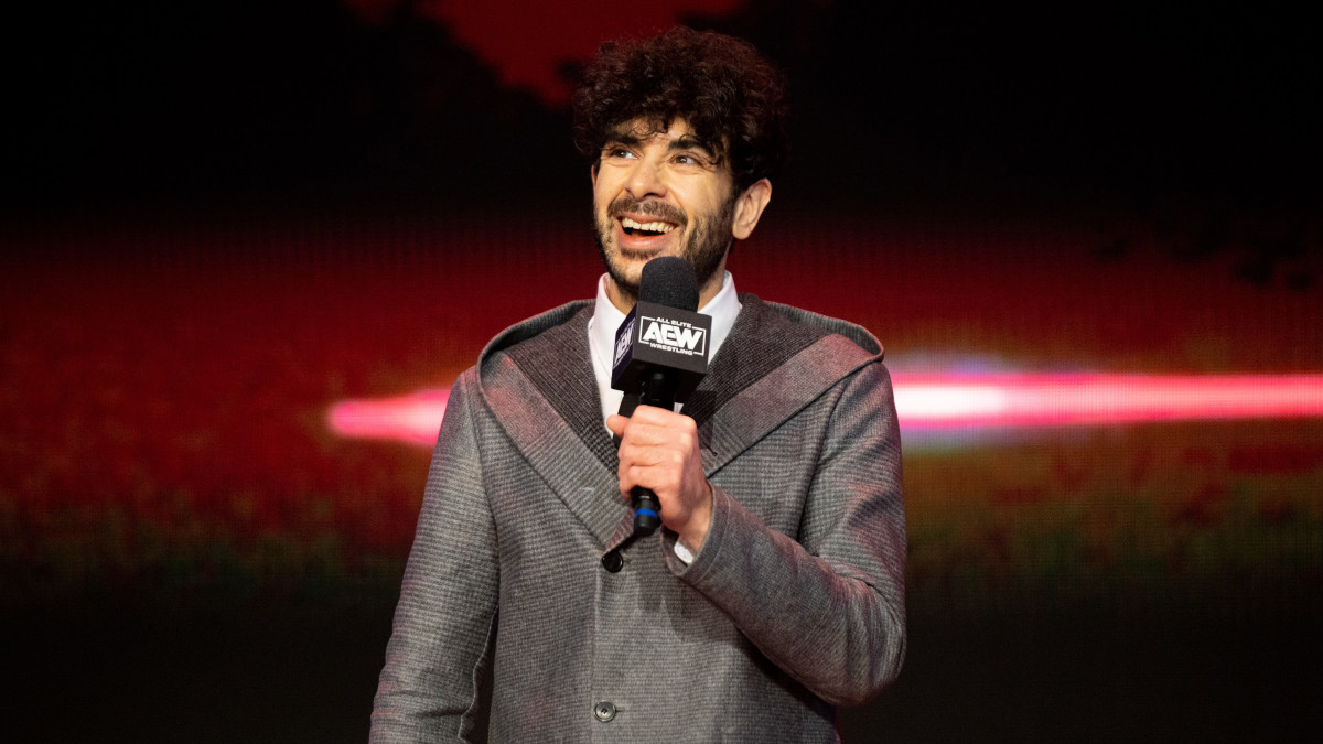 Tony Khan holding a microphone on AEW Dynamite