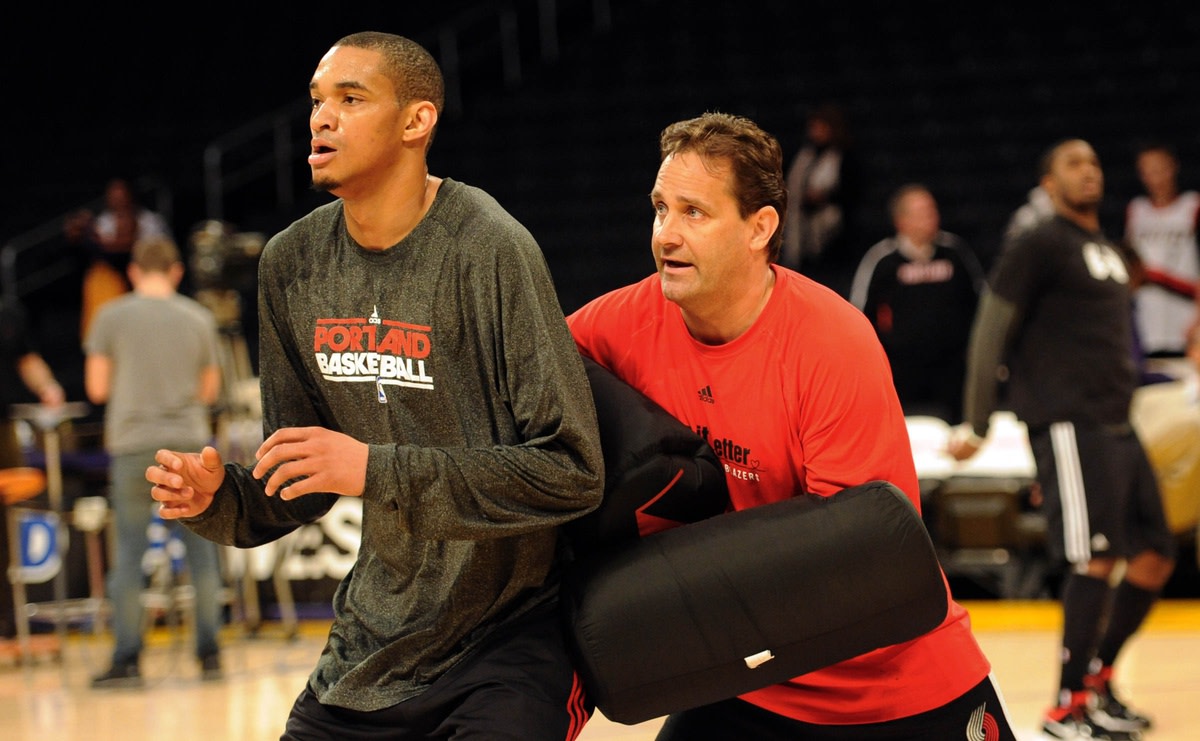 March 20, 2011; Los Angeles, CA, USA; Portland Trail Blazers center Chris Johnson (17) works out with assistant coach Bill Bayno using arm blocker pads before the game against the Los Angeles Lakers at the Staples Center.