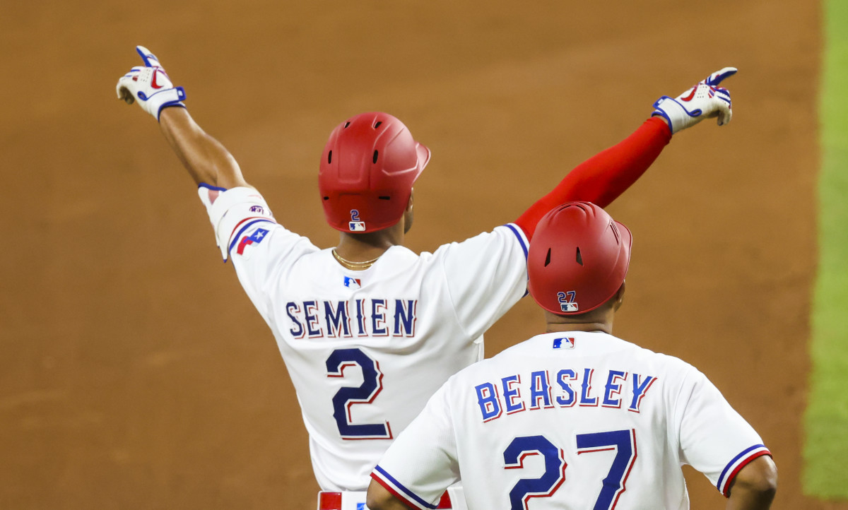 Jun 6, 2023; Arlington, Texas, USA; Texas Rangers second baseman Marcus Semien (2) reacts after hitting a two-run double during the fourth inning against the St. Louis Cardinals at Globe Life Field. Mandatory Credit: Kevin Jairaj-USA TODAY Sports
