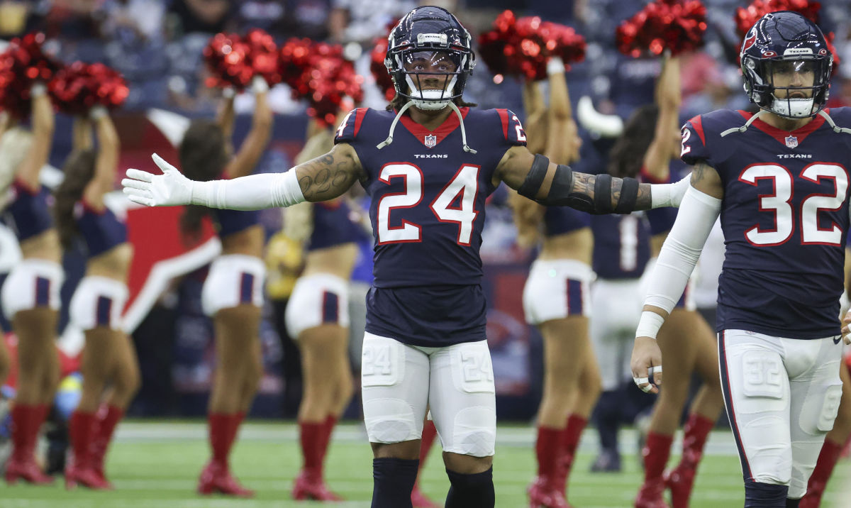 Houston Texans cornerback Derek Stingley Jr. stands on the field with his arms wide