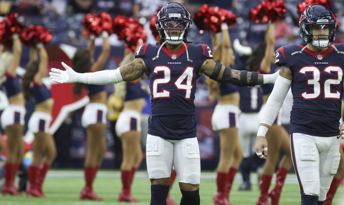 Houston Texans cornerback Derek Stingley Jr. stands on the field with his arms wide