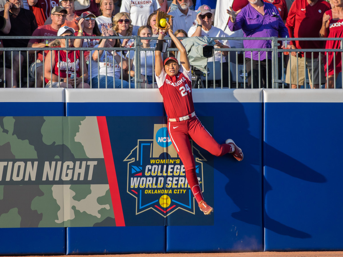Oklahoma outfielder Jayda Coleman makes a leaping catch at the wall in the Women's College World Series.