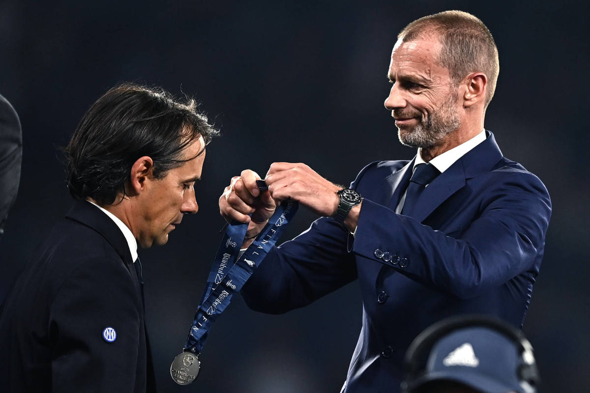 Inter Milan manager Simone Inzaghi pictured (left) looking dejected as he receives a silver medal from UEFA president Aleksander Ceferin following his team's 1-0 loss to Manchester City in the 2023 Champions League final