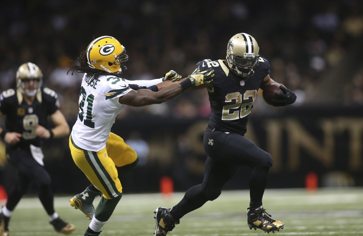 Oct 26, 2014; New Orleans Saints running back Mark Ingram (22) fights off Green Bay Packers cornerback Davon House (31) . Mandatory Credit: Crystal LoGiudice-USA TODAY