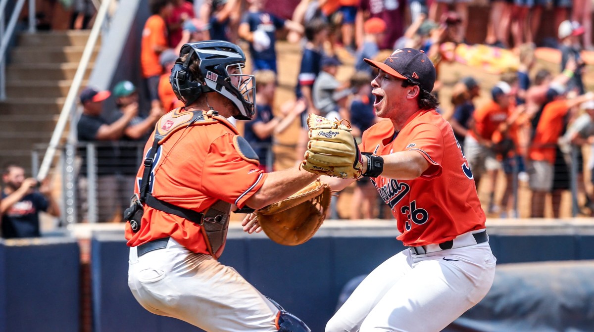 Kyle Teel celebrates with Brian Edgington after the Virginia baseball team defeated Duke at Disharoon Park to win the Charlottesville Super Regional of the 2023 NCAA Baseball Tournament to advance to the College World Series.