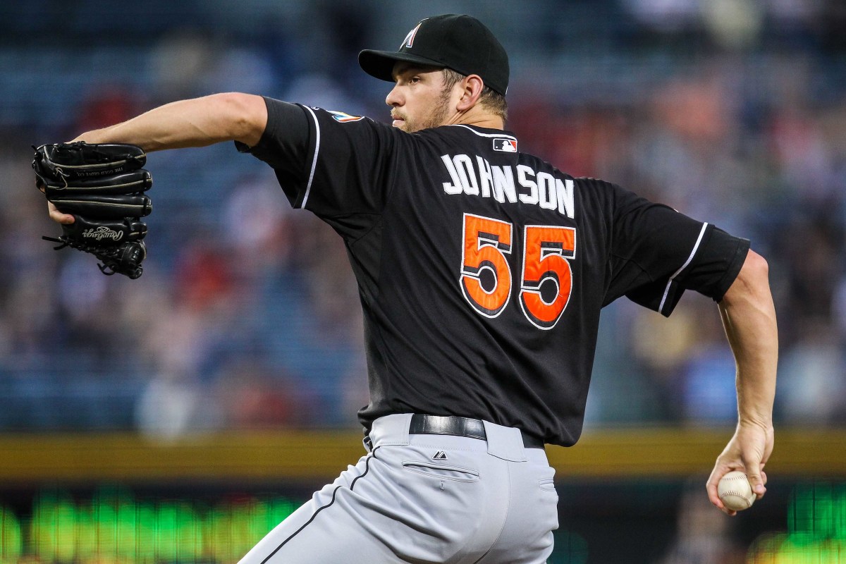 Miami Marlins starting pitcher Josh Johnson winds up to throw the ball
