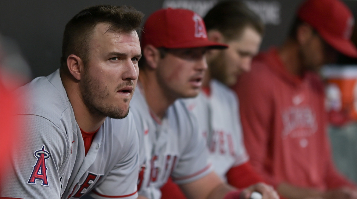 Angels’ Mike Trout looks on from the dugout.