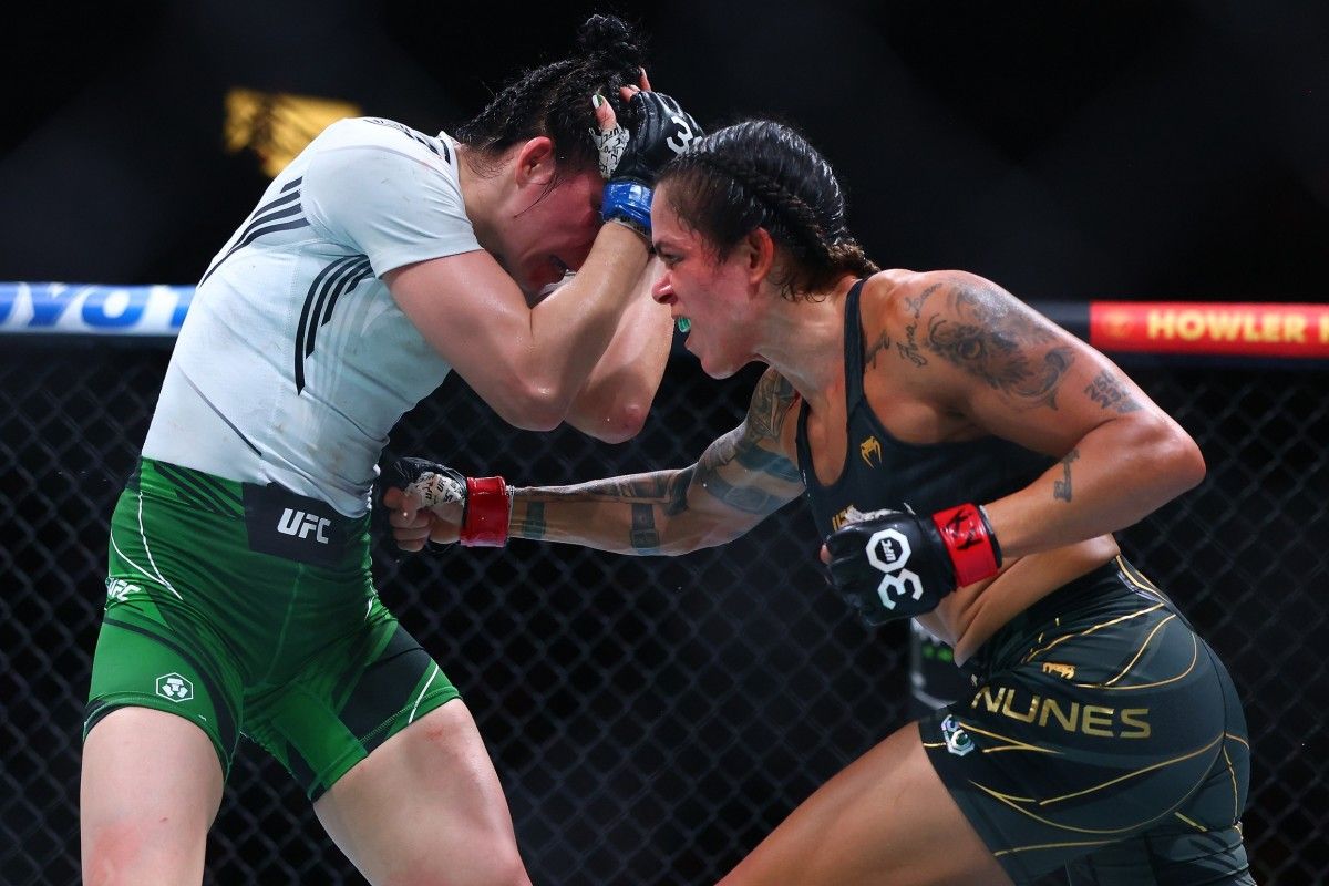 Amanda Nunes lands a body punch on Irene Aldana during their women's bantamweight title fight at UFC 289 inside Rogers Arena in Vancouver, British Columbia, Canada.
