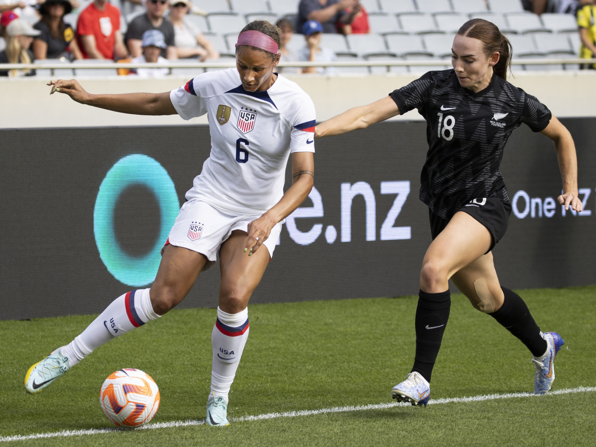 United States forward Lynn Williams and New Zealand's Mackenzie Barry battle for possession in an international friendly.