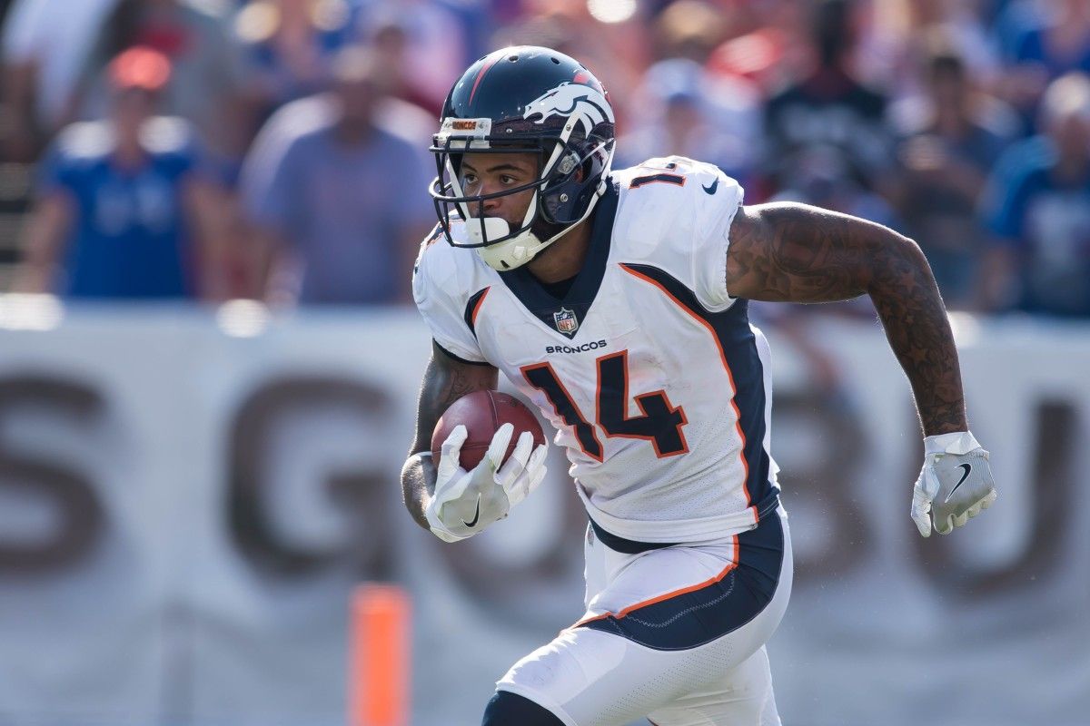 Denver Broncos wide receiver Cody Latimer (14) returns a kickoff during the fourth quarter of a game against the Buffalo Bills at New Era Field.