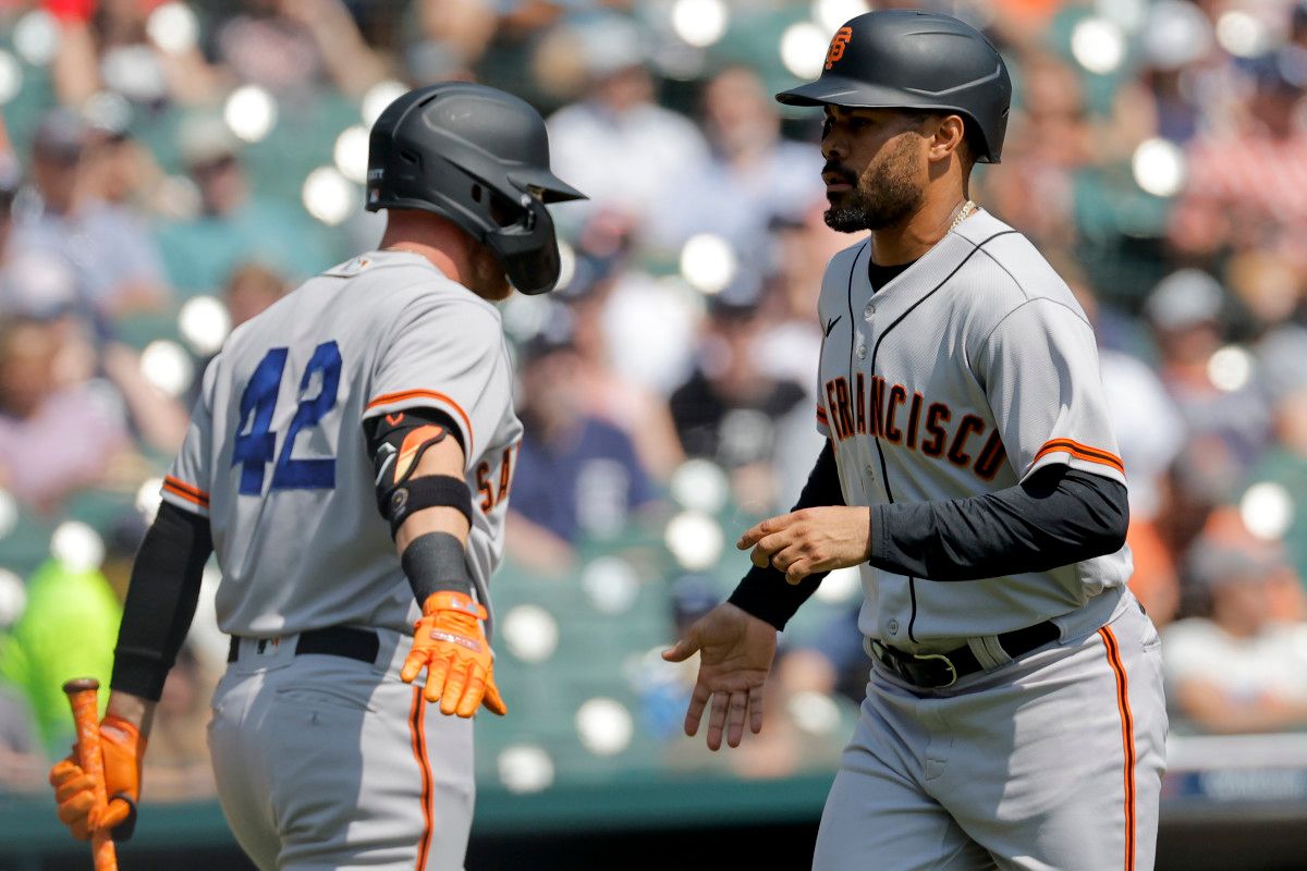 SF Giants first baseman LaMonte Wade Jr. (right) celebrates with fielder Matt Beaty (left) after scoring against the Detroit Tigers. (2023)
