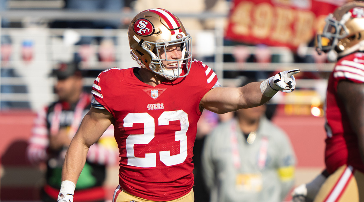 49ers running back Christian McCaffrey (23) smiles during the second quarter against the Commanders at Levi’s Stadium.