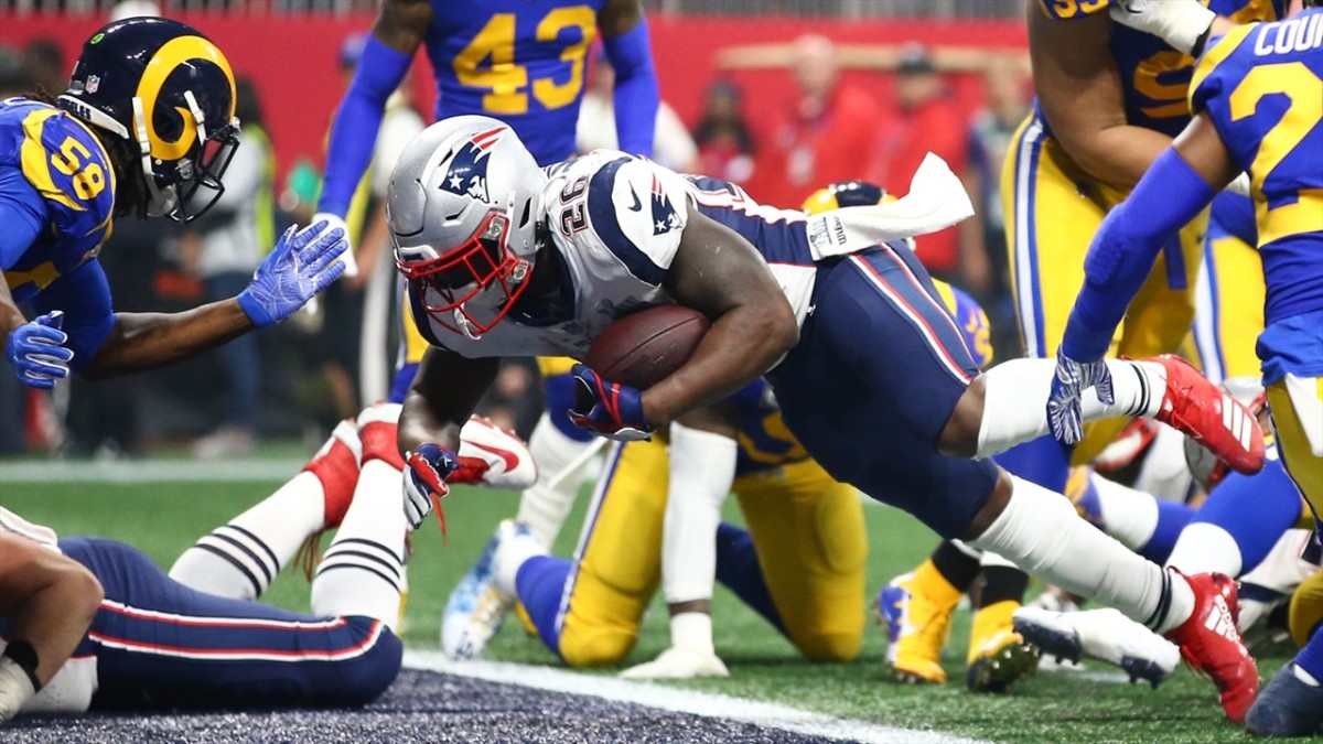 Sony Michel (26) leaps across the goal line during his 2018 rookie season to score the only touchdown in the New England Patriot's Super Bowl LIII victory over the Los Angeles Rams.